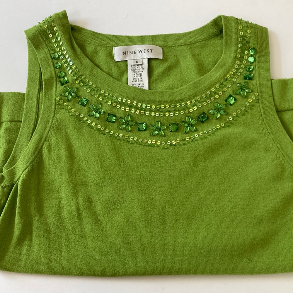 Pretty sweater with unique beaded detail. Use alone or under your blazer.
